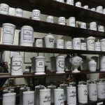 Pharmacy shelves stocked with medicines