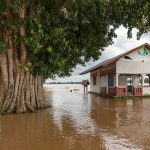 Homes on a flooded street after heavy rain