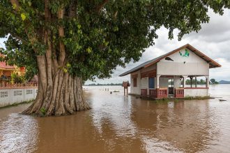 Homes on a flooded street after heavy rain