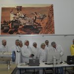 Semiconductor factory clean room with engineers producing computer chips
