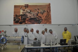 Semiconductor factory clean room with engineers producing computer chips