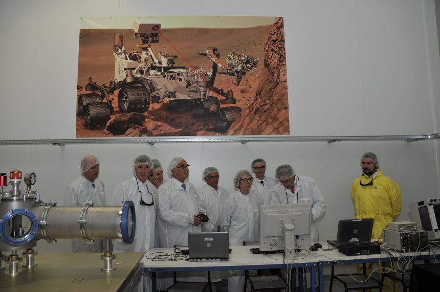Semiconductor factory clean room with engineers producing computer chips